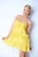 Pretty elegant woman wearing yellow dress