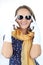 Pretty expressive lady wearing a polka dots dress white sunglasses and yellow scarf in the studio