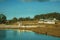 Pretty farm with fences, livestock sheds and lake