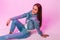 Pretty fashionable happy young woman with lovely smile in stylish youth blue jeans clothes rest and positive smiling near vintage