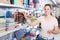 Pretty female buying products in stationery shop