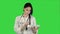 Pretty female doctor with stethoscope using tablet computer on a Green Screen, Chroma Key