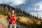 Pretty, female hiker going downhill