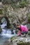 Pretty female hiker tying boot laces