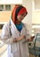 Pretty female Muslim doctor with stethoscope.