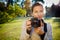 Pretty female photographer outdoors