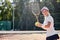 pretty female playing tennis game. Portrait of happy sportswoman with tennis racket