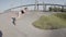 Pretty female skater riding longboard in skate park