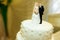 Pretty figures of newlyweds as an element of wedding cake decoration