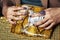 Pretty fingers of african american woman holding money closeup with purse, luxury jewellery on python clutch, cash for