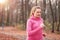 Pretty fit young woman jogging in woodland