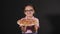 Pretty funny girl holding out ready delicious pizza. Smiling child with tasty pizza on hands. Pizzeria advertising. on