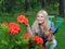 Pretty gardener woman with gardening tools