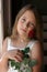 Pretty girl with diamond necklace and red rose