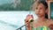 Pretty girl eating watermelon during sea cruise. Young girl eating watermelon