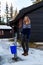 Pretty girl filling a bucket from a well - portrait