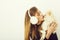 Pretty girl kissing cute pomeranian dog