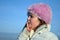 Pretty girl with a pink fluffy hat