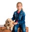 Pretty girl sitting with american spaniel on a wooden chest