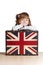 Pretty girl with a suitcase with British flag