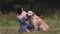 Pretty girl walking with golden retriever dog