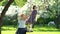 Pretty girls mother and daughter have fun on wooden swing. Static shot