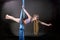 Pretty gymnast training on aerial silk