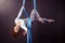 Pretty gymnast training on aerial silk