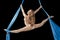 Pretty gymnast training on aerial silk