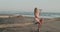 Pretty happy girl in dress relaxing on the tropical beach