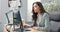 Pretty hard-working secretary of company assistant to boss manager sits at desk in office in front of computer screen