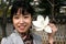 Pretty Korean woman holding a flower