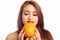 Pretty Latina Woman Smelling an Orange