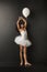 Pretty little ballet dancer with a ballon
