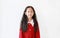 Pretty little child girl in scarlet red dress with Crystals on forehead and smiling on white background