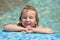 Pretty little girl bathe in pool, closed eyes