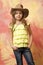 Pretty little girl with cute face in western cowboy hat