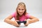 Pretty little girl holding a gaming console