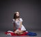 Pretty little gymnast posing with colorful cloth