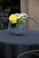 Pretty little painted vase of flowers on table