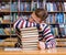 Pretty male student sleep in library