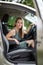 Pretty midle aged woman at the steering wheel of her car