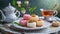 A pretty Mothers\\\' Day or Easter high tea with delicious petit four biscuits.