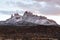 Pretty mountain with several peaks covered in dusting of snow in Springdale at dusk