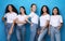 Pretty Multicultural Girls Smiling Standing On Blue Studio Background