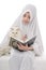 Pretty Muslim Girl and Cat with Holy Book of Quran