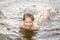 Pretty nice little girl swimming in lake
