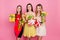 Pretty, nice trio of girls in dresses, having colorful tulips in