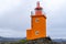 Pretty orange Hopsnes Lighthouse near Grindavik, Iceland on the Reykjanes Peninsula