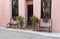 Pretty pink building and benches